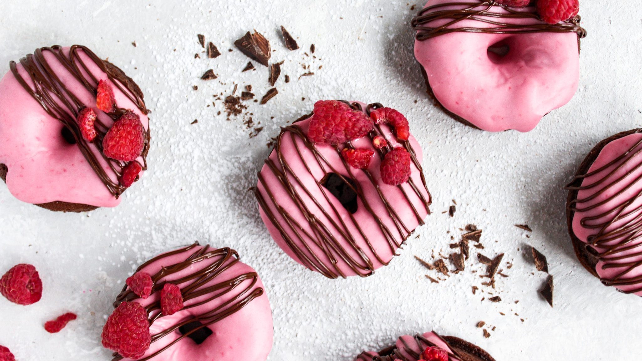  Topped with effortlessly easy raspberry glaze and decorated with melted chocolate and chopped raspberries.
